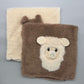 Alpaka Zierkissen 40x40 cm aus Alpakawolle mit 3D Alpaka Motiv in Braun und Weiß, perfektes Wohnaccessoire.