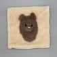 Alpaka Zierkissen 40x40 cm aus Alpakawolle mit 3D Alpaka Motiv in Braun und Weiß.