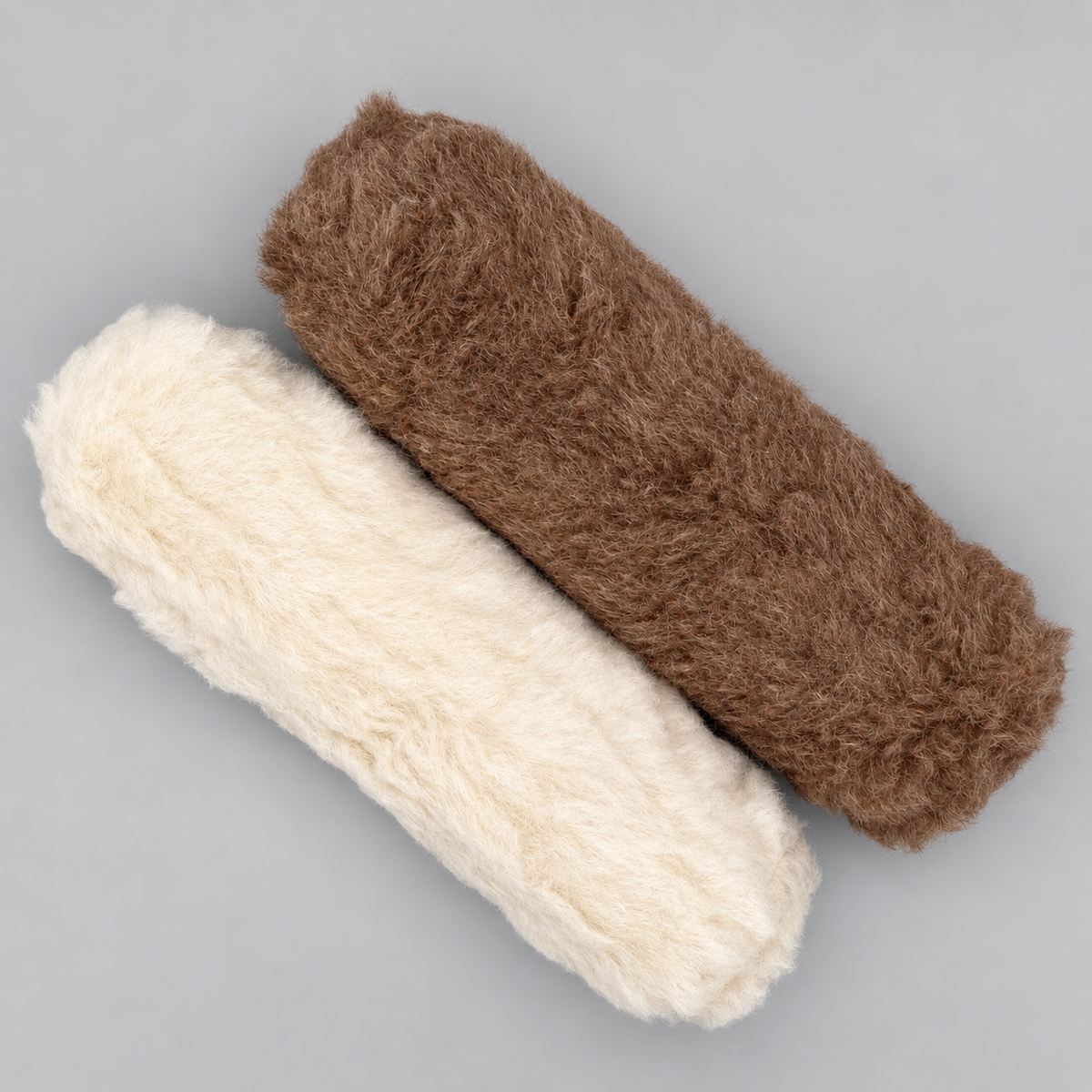 Alpaka Nackenrolle 12×45 cm aus Alpakaflor in Braun und Weiß