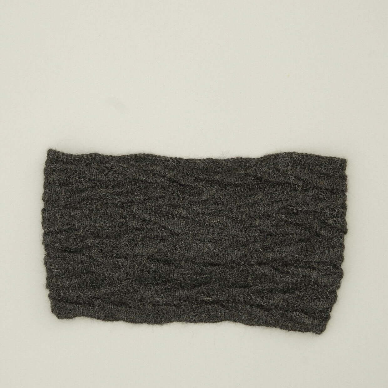 Alpaka Stirnband Damen aus 100% Babyalpaka mit Knotendetail in Dunkelgrau zum alpaka stirnband kaufen.