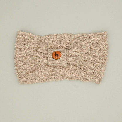 Alpaka Stirnband kaufen, Damenmodell aus 100% Babyalpaka mit Knotendetail in hellbeige.